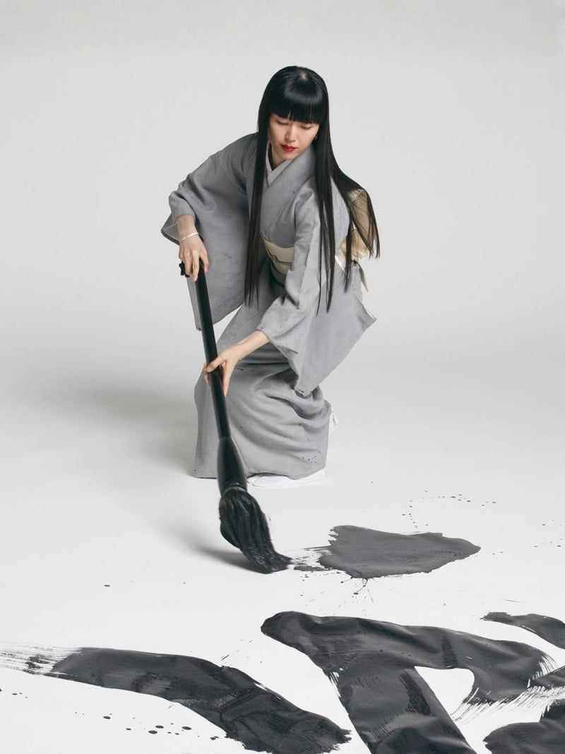 MAMIMOZI artist in traditional Japanese-inspired garment, MAMIMOZI and HEAVENSAKE artistic collaboration