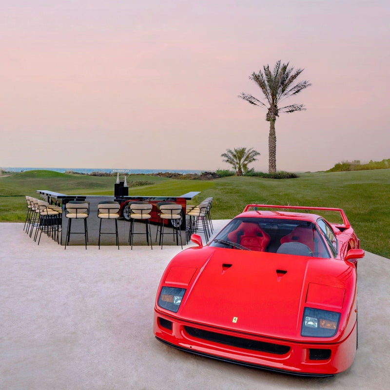 Red Ferrari supercar at RM Sotheby's auction event with HEAVENSAKE sake, rare craft collecting