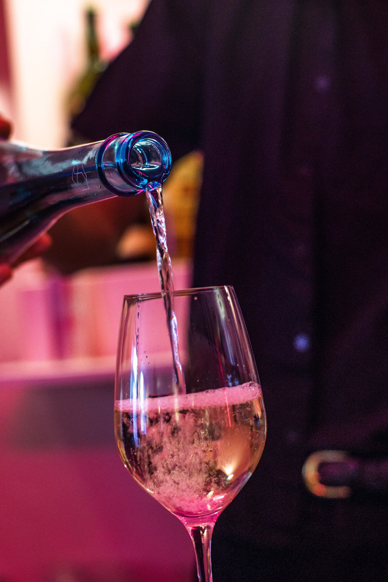 HEAVENSAKE poured into a white wine glass.