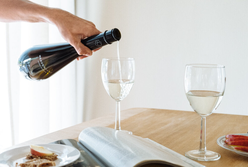 Sake poured into a white wine glass at home.